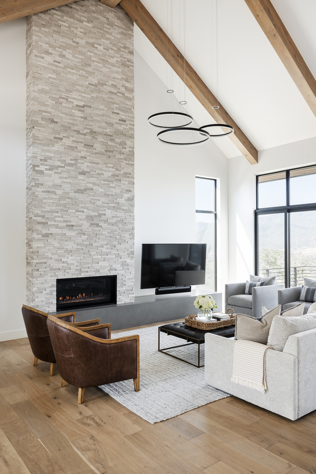 Open living room with high ceilings and round light fixture